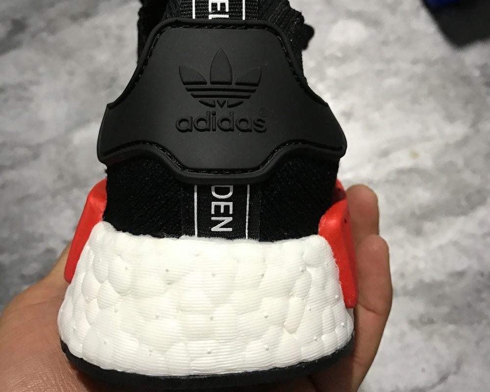 nmd r1 primeknit red and black