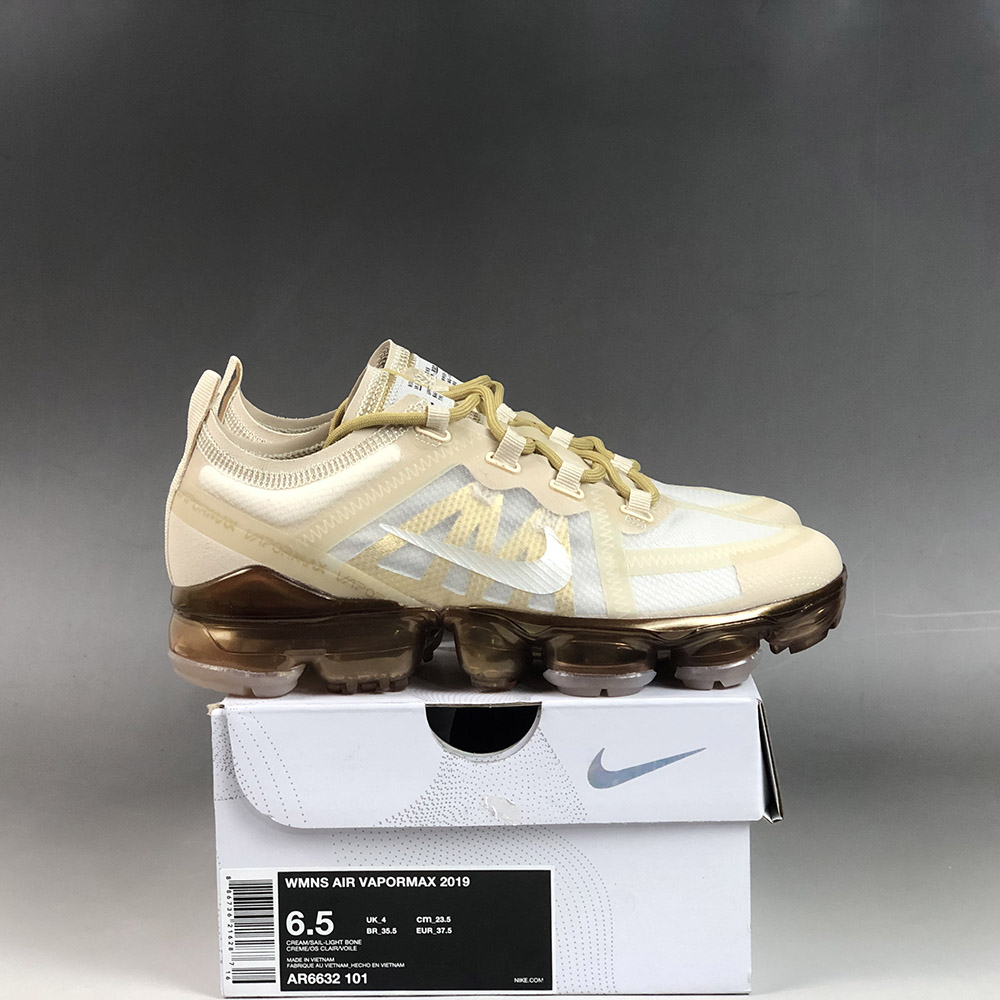 gold and white vapormax