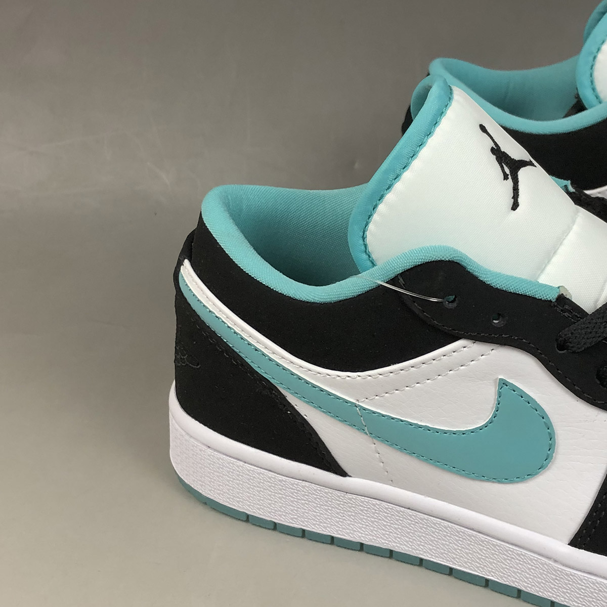 black and turquoise jordans