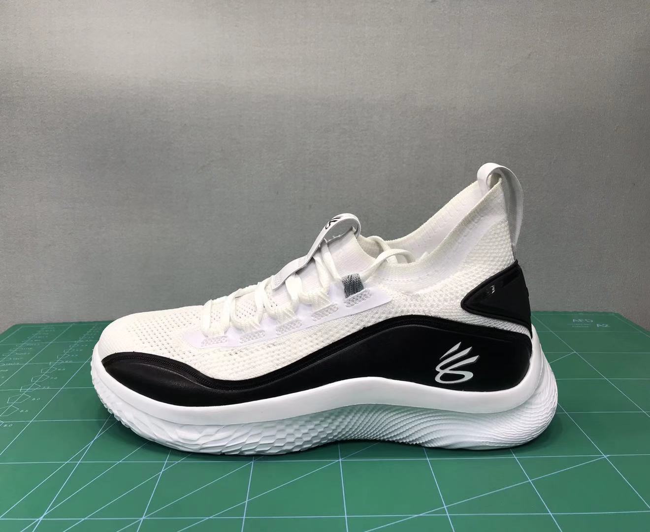 black and white curry shoes